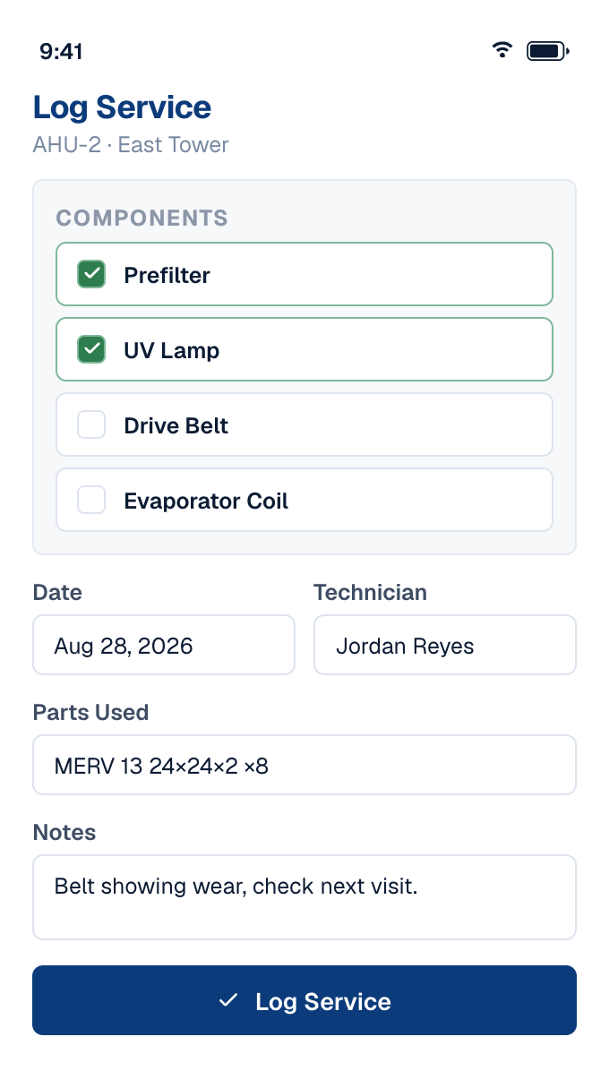 A technician logging a completed service from a phone in the field
